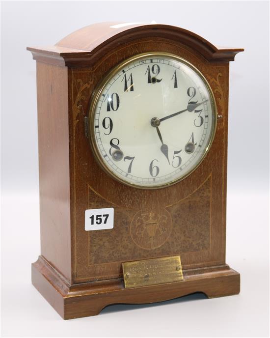 A inlaid mahogany mantel clock